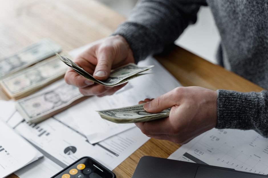 Tax forms, a calculator, and a pen, representing the importance of tax planning with home equity loans